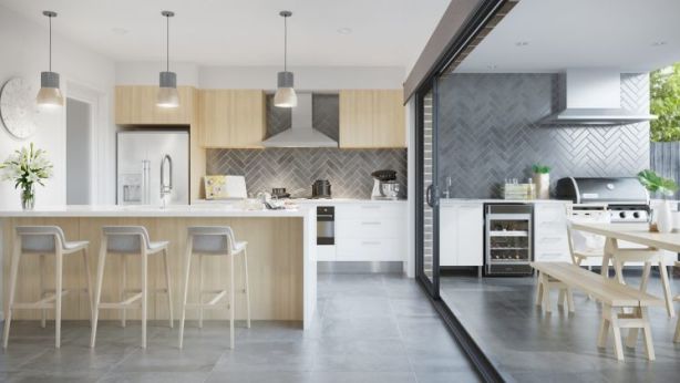 The large living, dining and kitchen space at the rear flows into an al-fresco dining area. Photo: Supplied