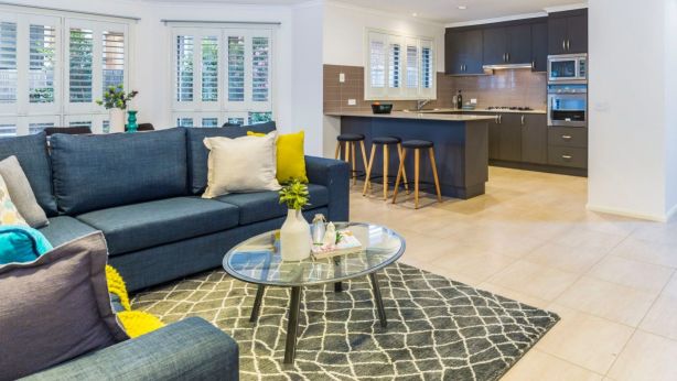 Soft, textural throws, rugs and cushions, such as those inside 7 Rickman Street in Forde, can create warmth. Photo: Supplied