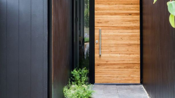 12 Grevillea Street humbly blends into the O'Connor streetscape with stunning raw materials surrounding its exterior. Photo: LightStudies