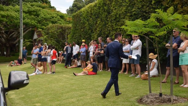 Part of the crowd gathered to watch the 33 Sutherland Avenue auction. Photo: Jim Malo