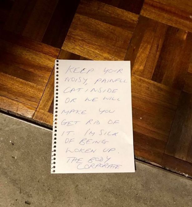 The note slipped under Ms Warzecha door. Photo: Supplied