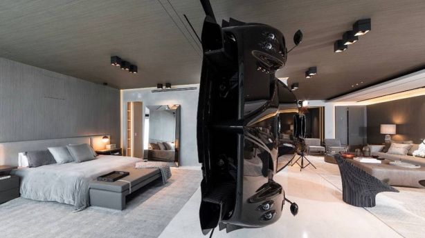 The owner of the $11.7m condo wanted the interior designed around the car, with similar sleek aesthetics. Photo: Finish My Condo