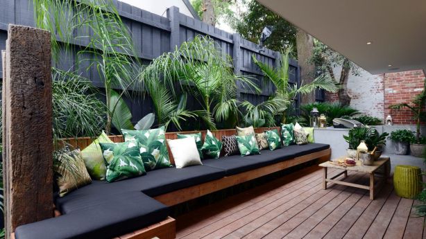 A covered, decked entertaining space can boost the value of ground-floor apartments. Photo: Martin Philbey