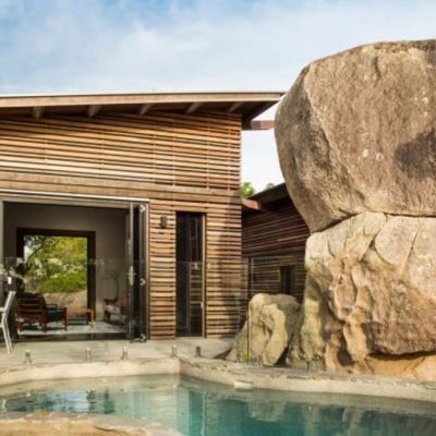 Cyclones and sustainability inspire Magnetic Island home built into boulders