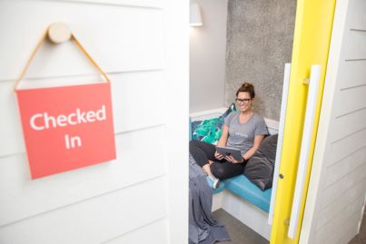 Airbnb's new home sweet home has a mini footy field, whisky bar bathrooms and secret door