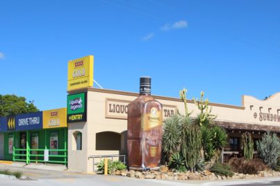 Queensland pub with giant Bundy bottle is part of rare hotel portfolio for sale