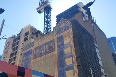 Another old painted sign briefly reappears on a Sydney building during demolition for new Wynyard Place development
