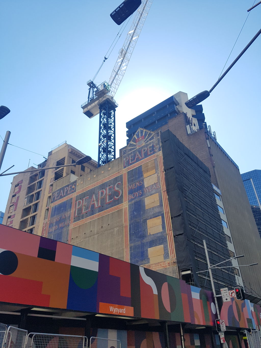 Another old painted sign briefly reappears on a Sydney building during demolition for new Wynyard Place development