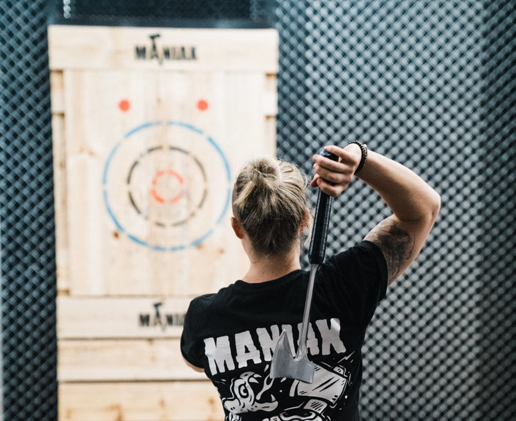 "It really adds to the atmosphere": Axe-throwing clubs want to serve alcohol