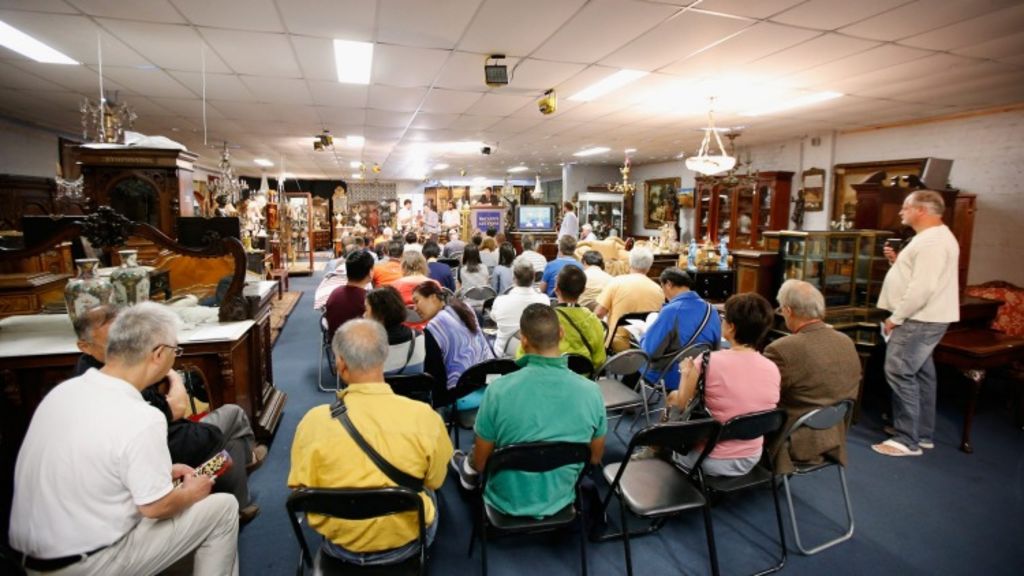 Christian McCann auction off items at a French furniture auction in Melbourne, Victoria. Photo: Darrian Traynor