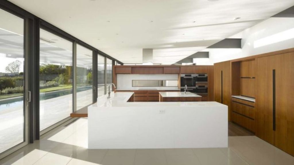 The house is divided into two wings with the kitchen, living and dining rooms to one side and the bedrooms on the other. Photo: SPF Architects