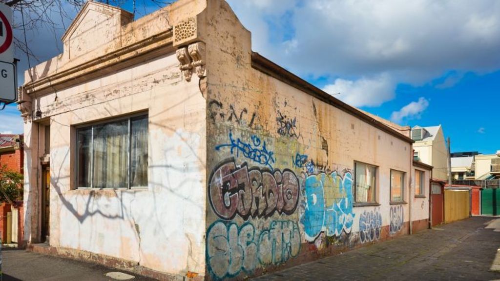 Fitzroy North house covered in graffiti for sale at about 1 million