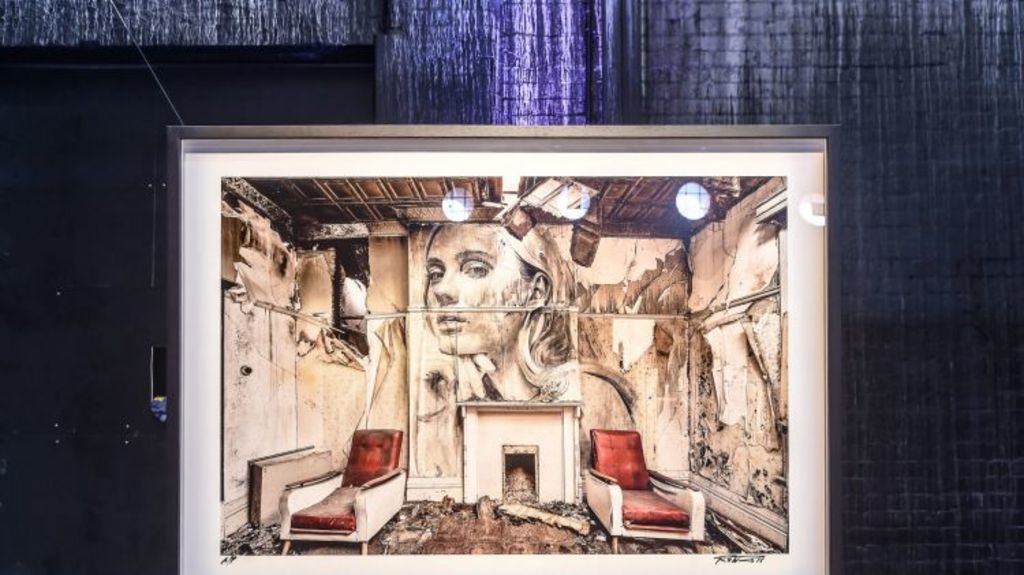 A photograph of one of the derelict Melbourne houses where Rone has painted a mural, shown in an exhibition last month. Photo: Justin McManus
