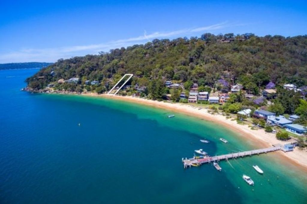 The secluded beachside suburb where mail arrives by ferry
