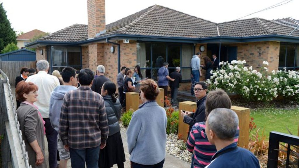 Property buyers queuing at an open home.