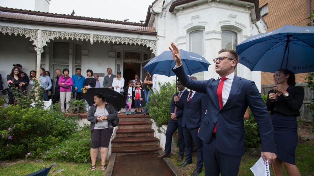 Auctioneer Jesse Davidson of AuctionWorks at the auction of 5 George Street, Marrickville. Photo: Fiona Morris