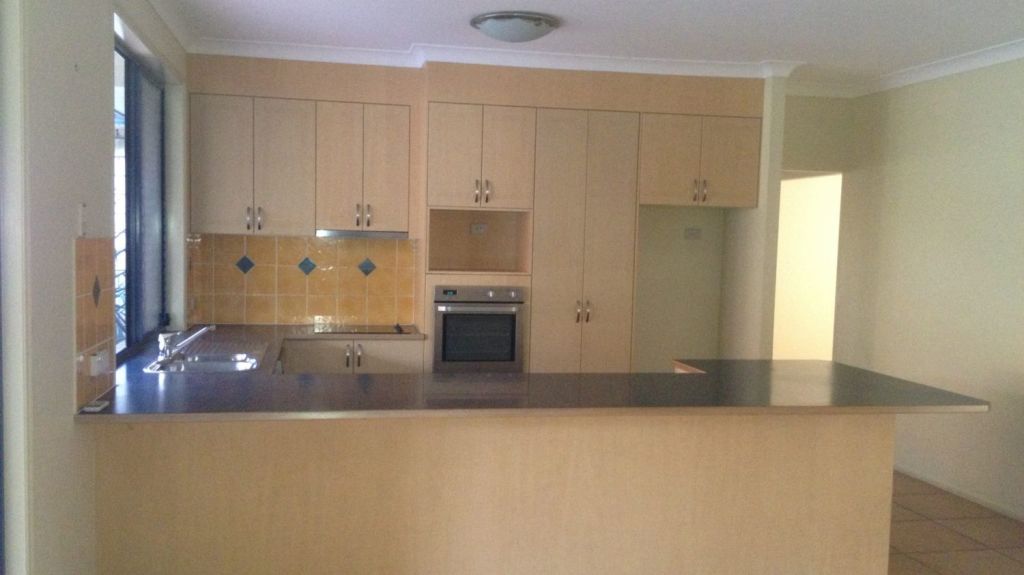 Before: Grey Gum property kitchen. Photo: Hotspace Consultants