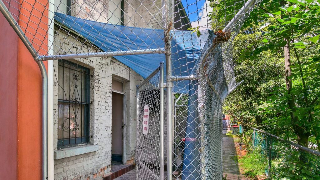 dilapidated redfern terrace that squatter tried to claim to be sold by trustee