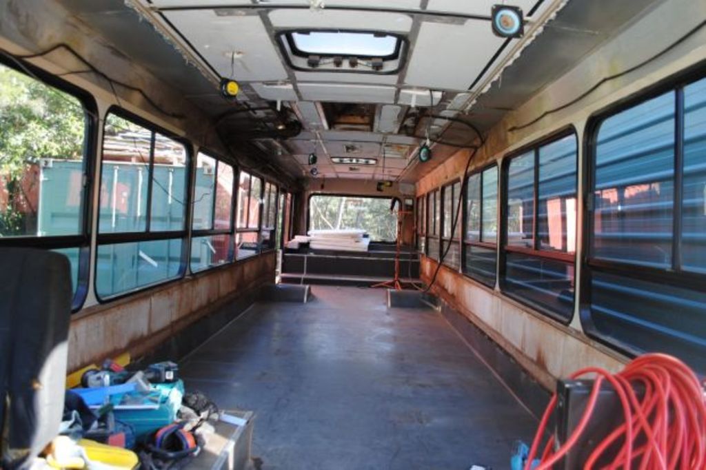 Meet the tradie turning buses into homes for Sydneysiders