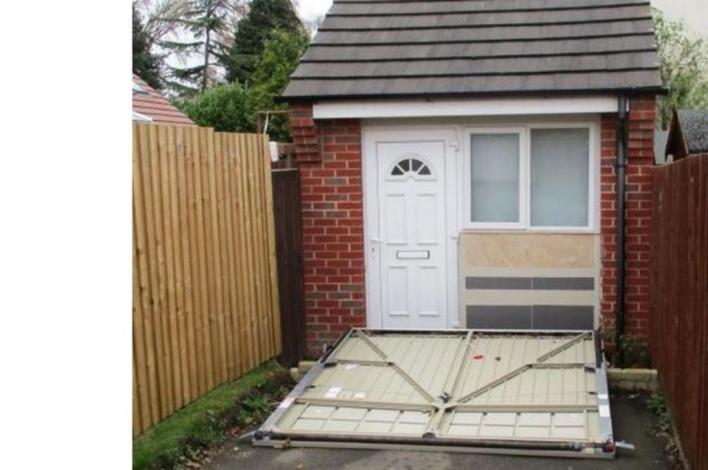 UK couple fined for hiding tiny house behind fake garage door