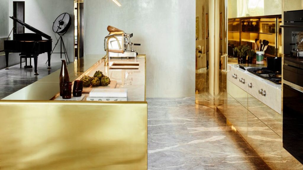 Presenting like a burnished pavilion that wouldn't be out of place in Versailles, the kitchen is also almost entirely brass. Photo: Mark Roper
