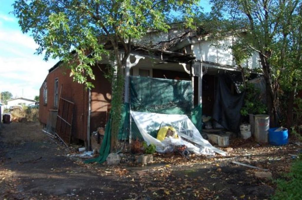 Derelict home in Granville for sale with piles of rubbish included