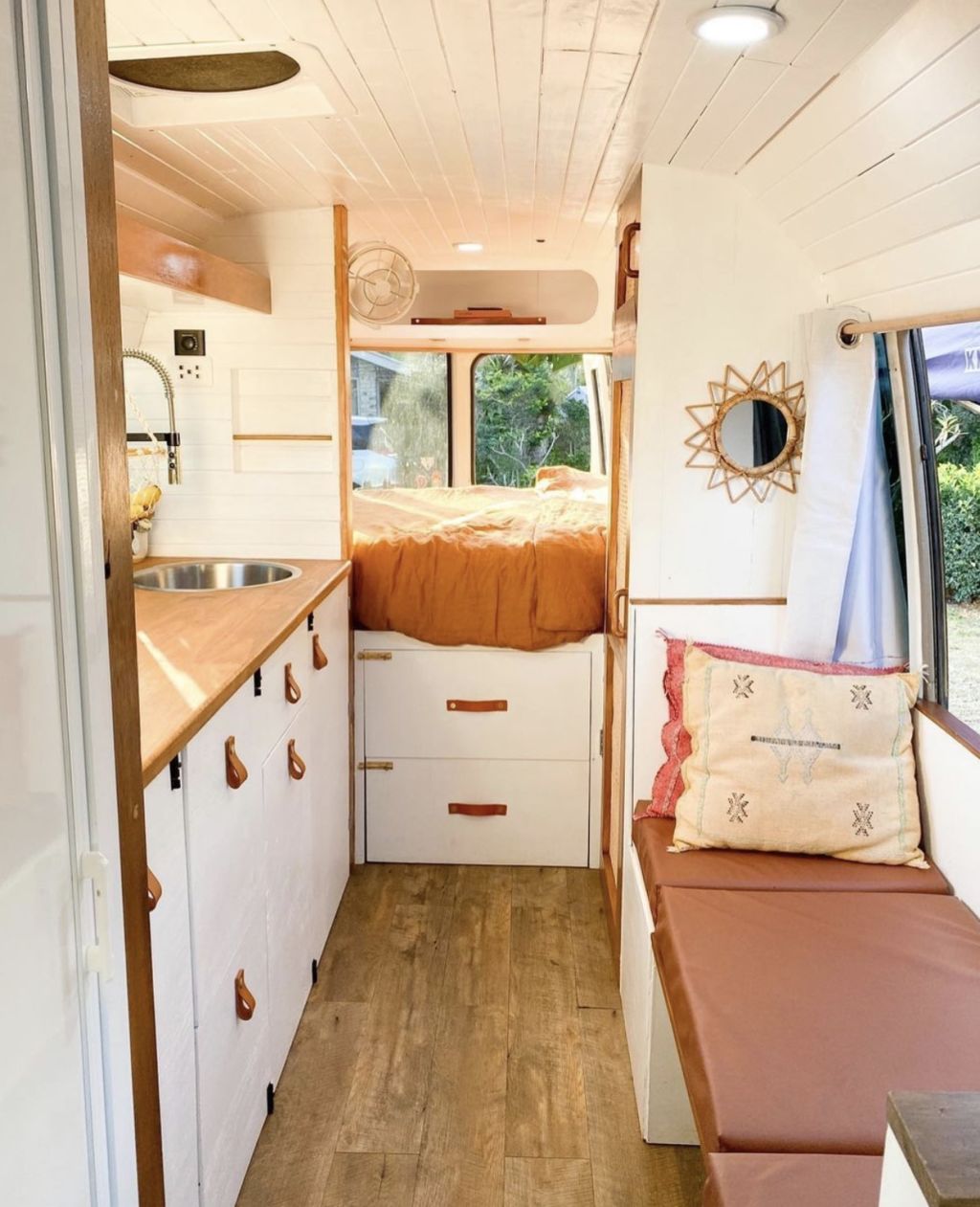 This young couple converted a 15,000 Toyota Coaster into their first home