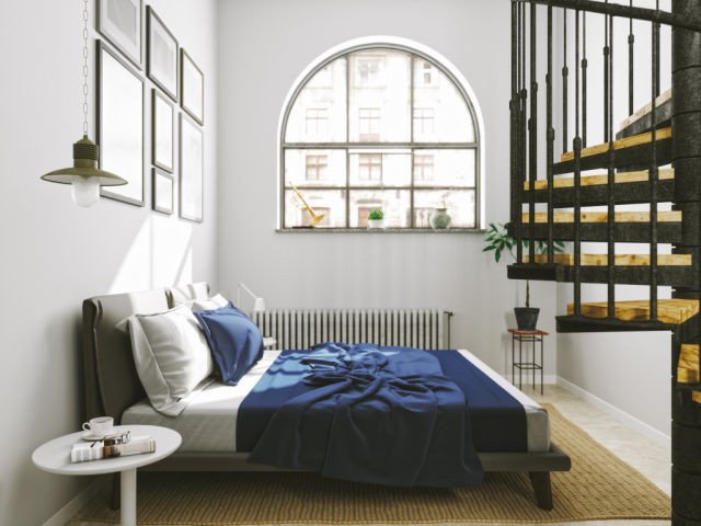 Interior of a bedroom with modern furniture.