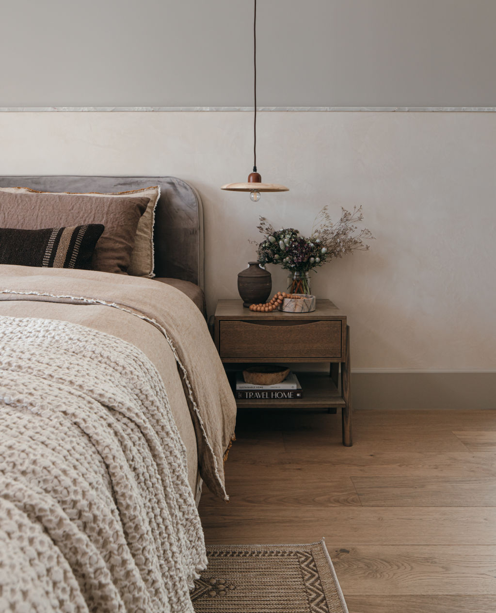 House Two's main bedroom embraces warmer-toned linens with plenty of texture and personality. Photo: Grace Picot