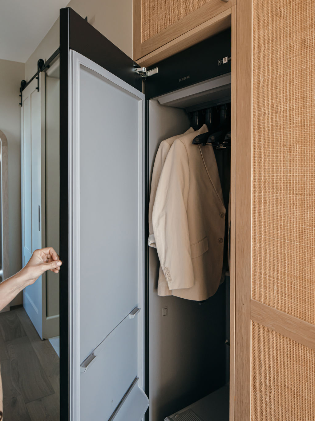 Both houses include an innovative steam-cleaning cupboard in the walk-in wardrobes. Photo: Grace Picot