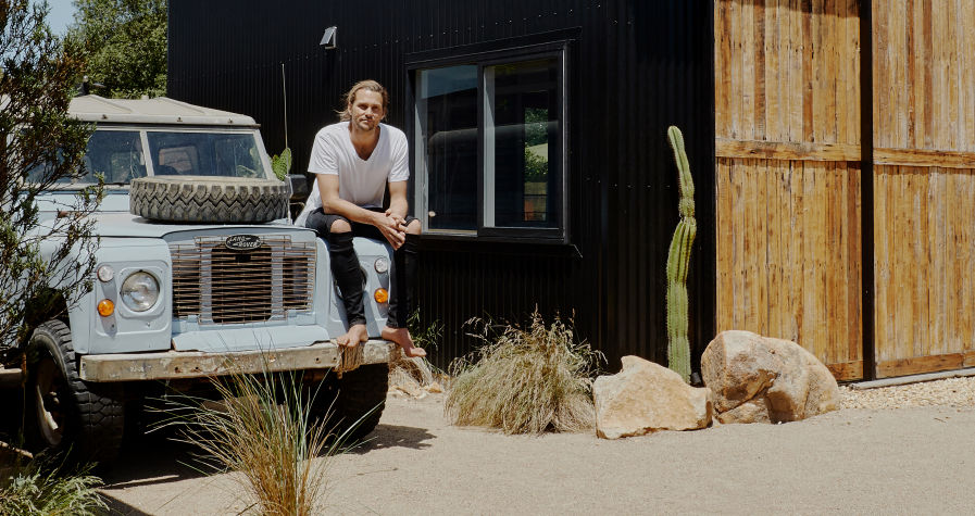 Model Rhys Uhlich at his new 'Shed House' on Phillip Island. Photo: Amelia Stanwix