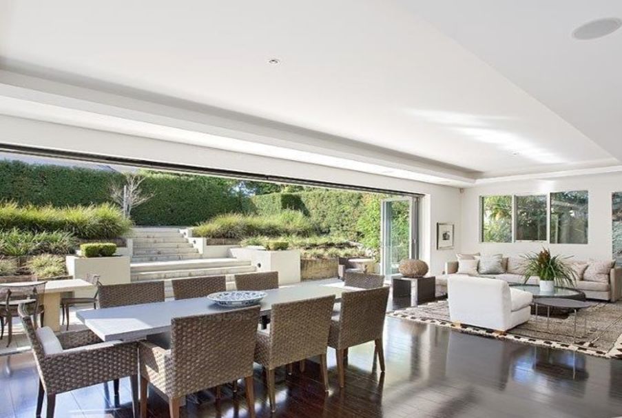 The contemporary Rose Bay residence has a half basketball court and a swimming pool.