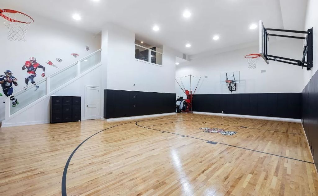 The lower level contains a top-notch basketball court. Photo: Zillow/Coldwell Banker Realty Dawn McKenna Group