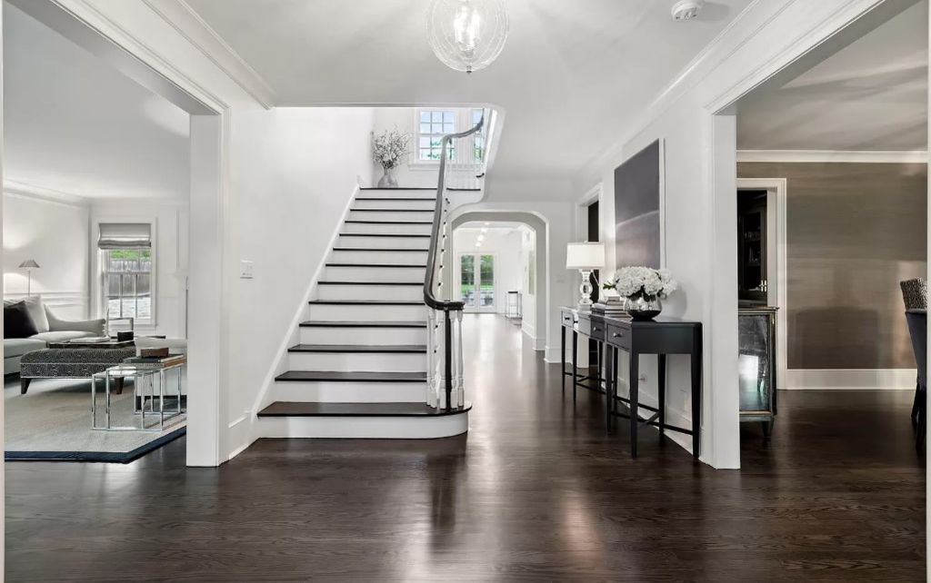 While the property underwent a major renovation in 2018, the staircase in the foyer has been maintained. Photo: Zillow/Coldwell Banker Realty Dawn McKenna Group