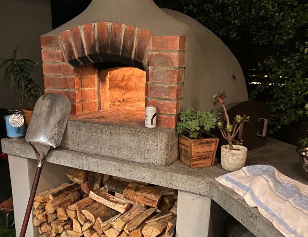 Pizza ovens aren't just for pizzas. Roast chicken and pork crackling are just some of the possibilities. Photo: Nina Hendy