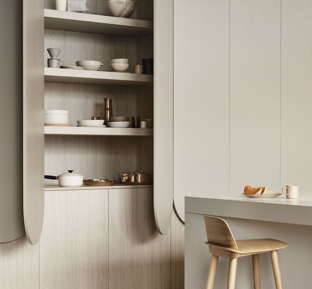 The kitchen embraces nature through sculptural curves and organic colours. Photo: Derek Swalwell