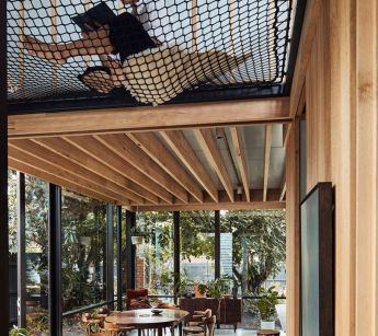A_reading_space_above_the_living_area_is_facilitated_by_a_simple_net._Miranda_Louey_the_architect_s_wife_tries_it_out._Pix_Peter_Bennetts_zwkhx6