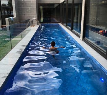 THE_LAP_POOL_IS_CENTRAL_TO_THE_HOUSE_cxlqu8