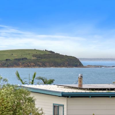 Holiday home loved by three generations of one family sells at auction for under $1 million