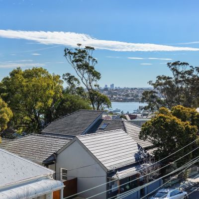 The secret to affordable Sydney water views? It's hiding above a corner shop.