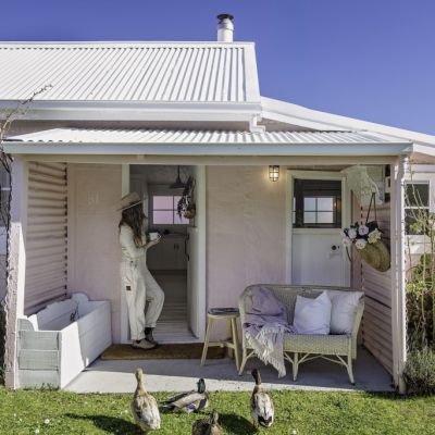 Pretty in pink miner’s cottage on rugged Tassie coastline for $495K, which makes its owners $44k a year