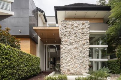 An indoor water feature adds a touch of drama to this Brisbane mansion for sale