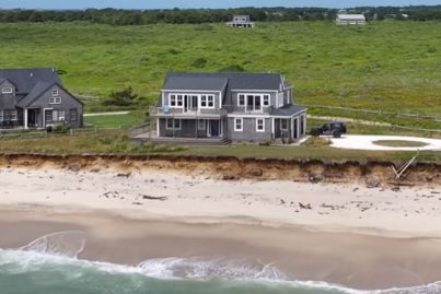 Watch as the ocean creeps in to swallow this waterfront mansion