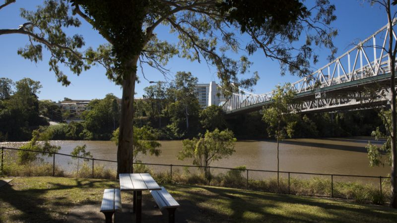 Why locals won't leave this riverside Brisbane suburb