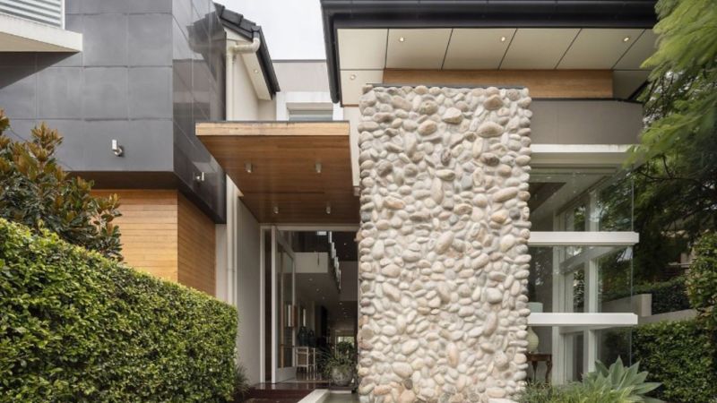 An indoor water feature adds a touch of drama to this Brisbane mansion for sale