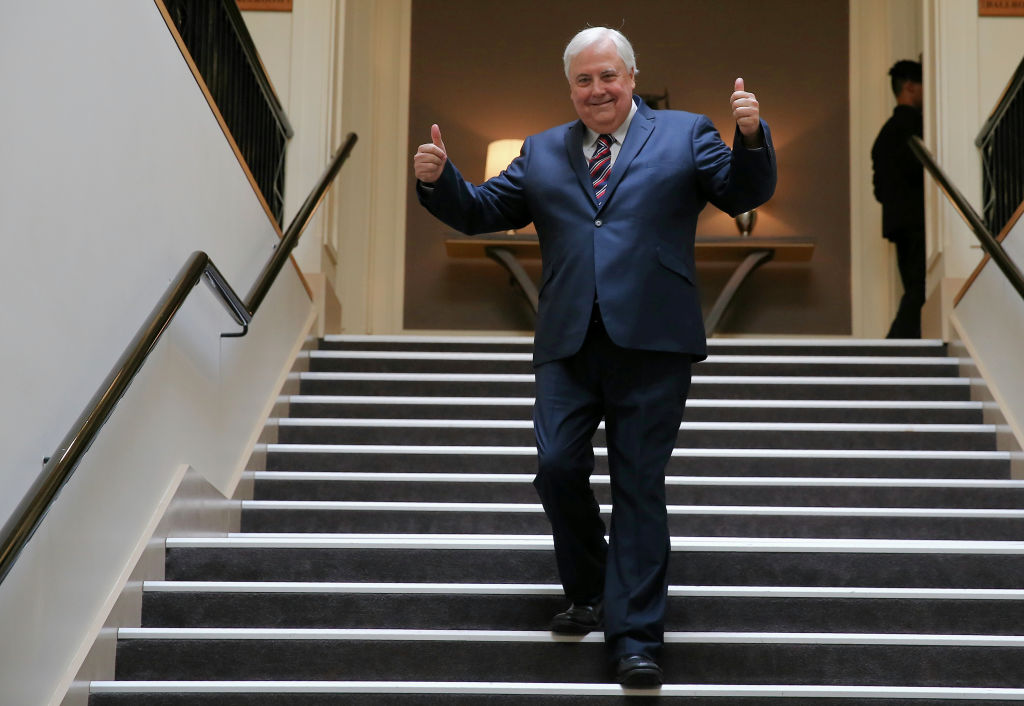 Sun's out, thumbs up: Soaking up some rays on the Gold Coast will be easy for Clive Palmer this summer, after he moved into his new beach house at Hedges Avenue this week. Photo: Alex Ellinghausen