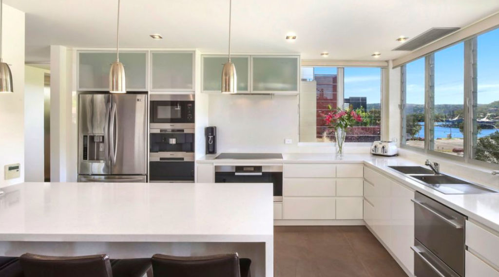 The kitchen is equipped with Caesarstone bench tops and Miele appliances. Photo: LJ Hooker Terrigal