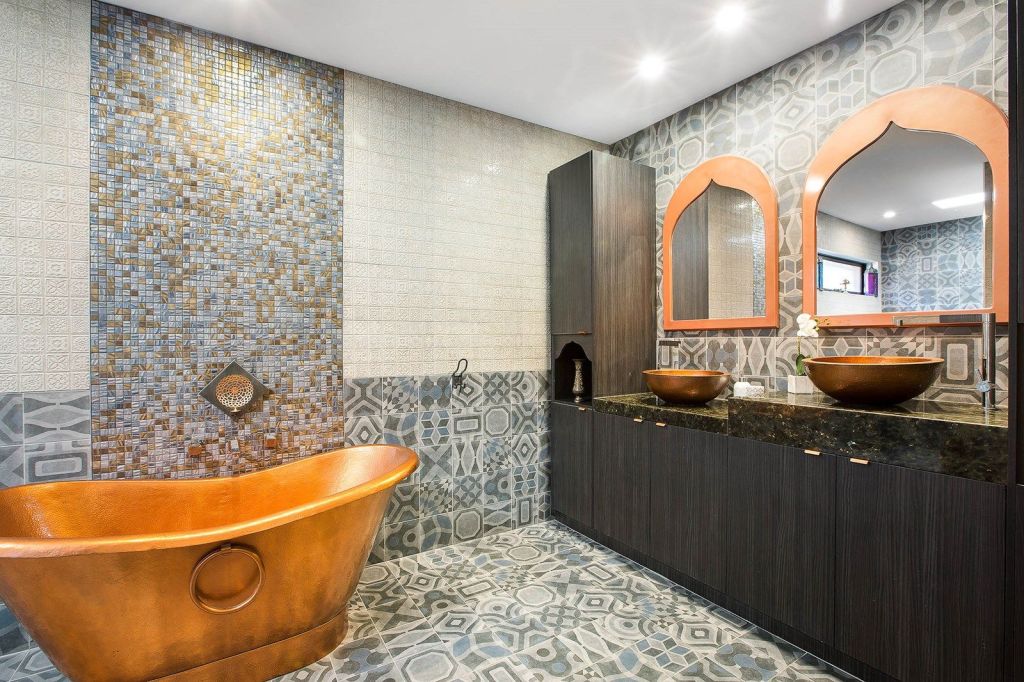 The copper freestanding bath is the hero of the Moroccan-inspired bathroom. Photo: Barlow McEwan Tribe