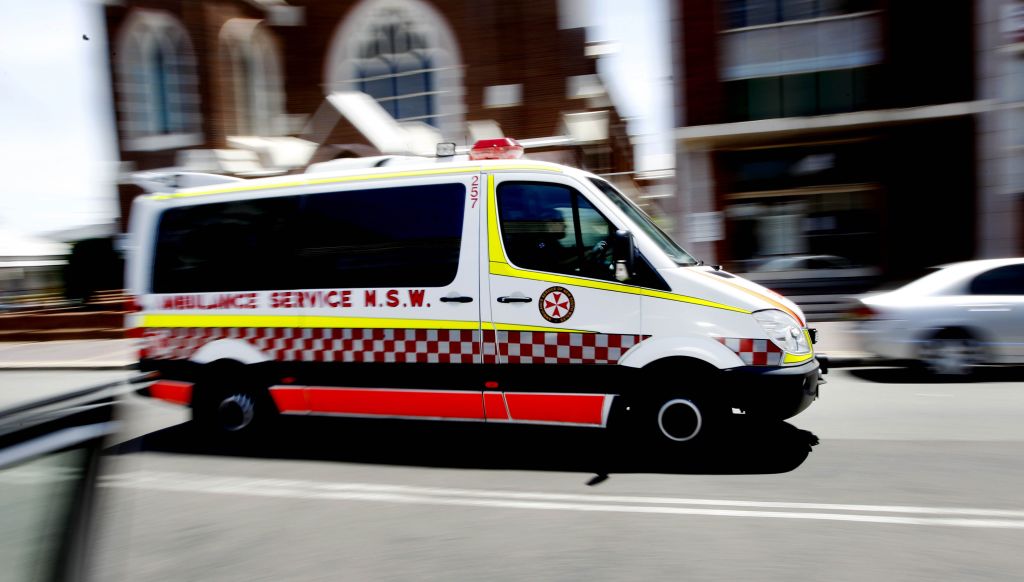 Ambulance driving down street