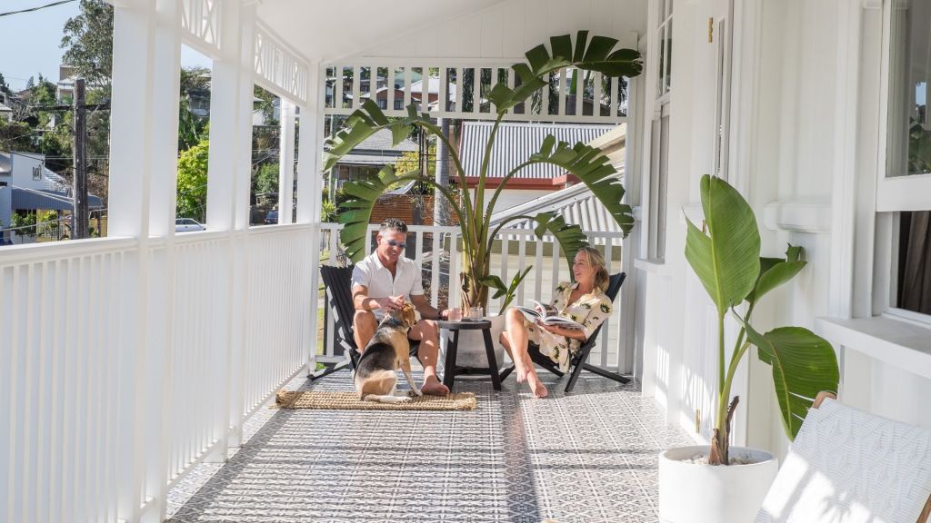 Owners of 45 Hayward St, Paddington, Gerry Heffernan and Natalie Winter with their dog Snoopy. Photo: Ray White New Farm. Photo: undefined